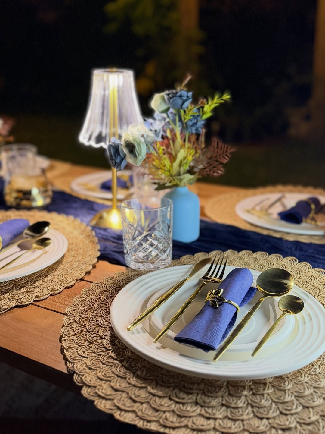 Navy and gold styled picnic table setting
